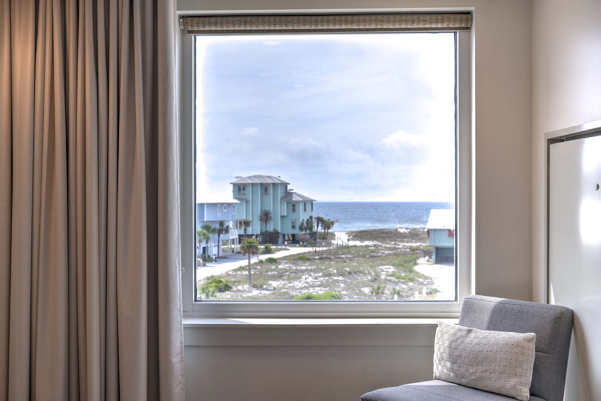 Guest room window with a view of the beachside
